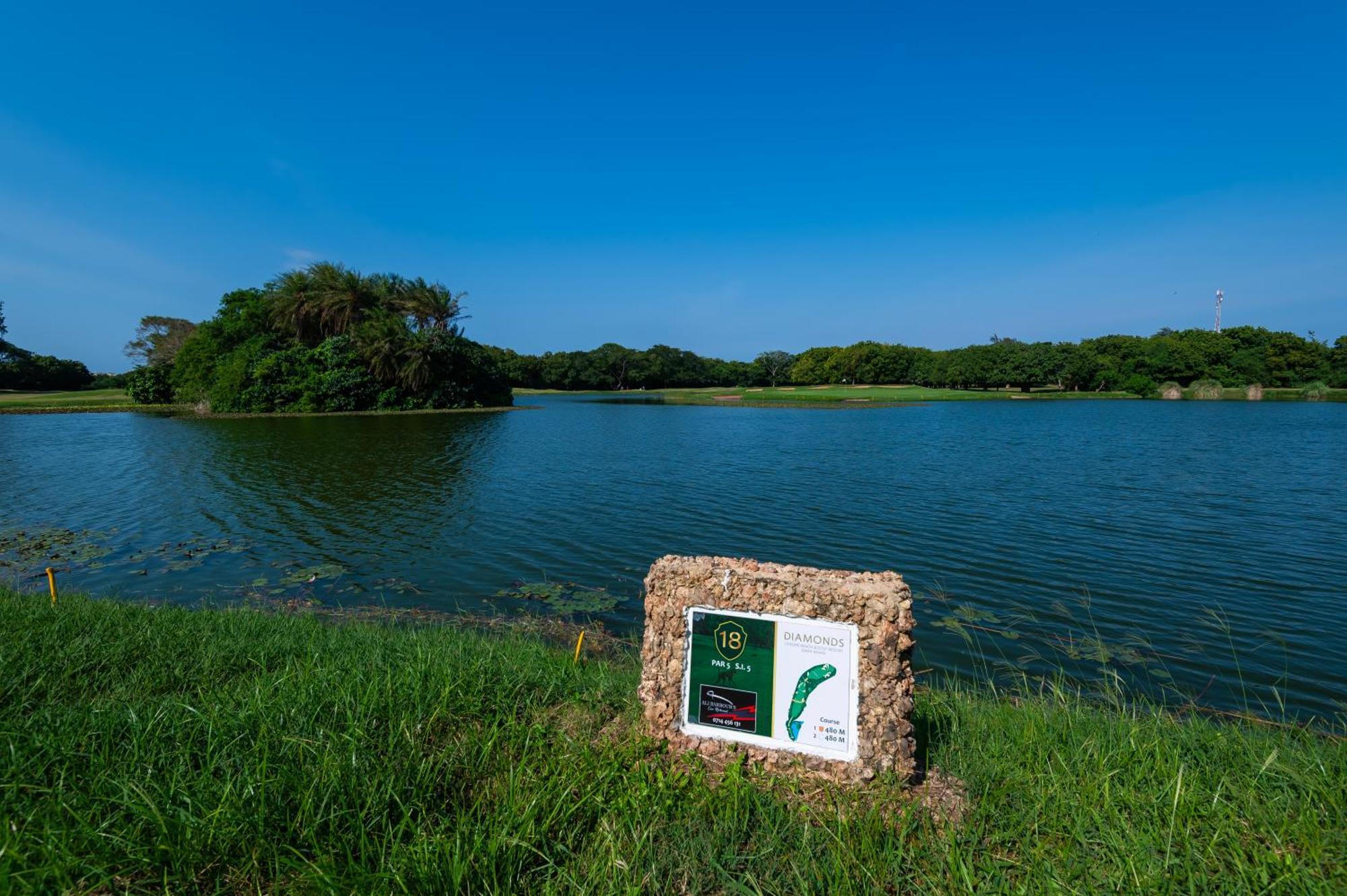 Diamonds Leisure Beach & Golf Resort Diani Beach Exterior photo Golf course at the resort