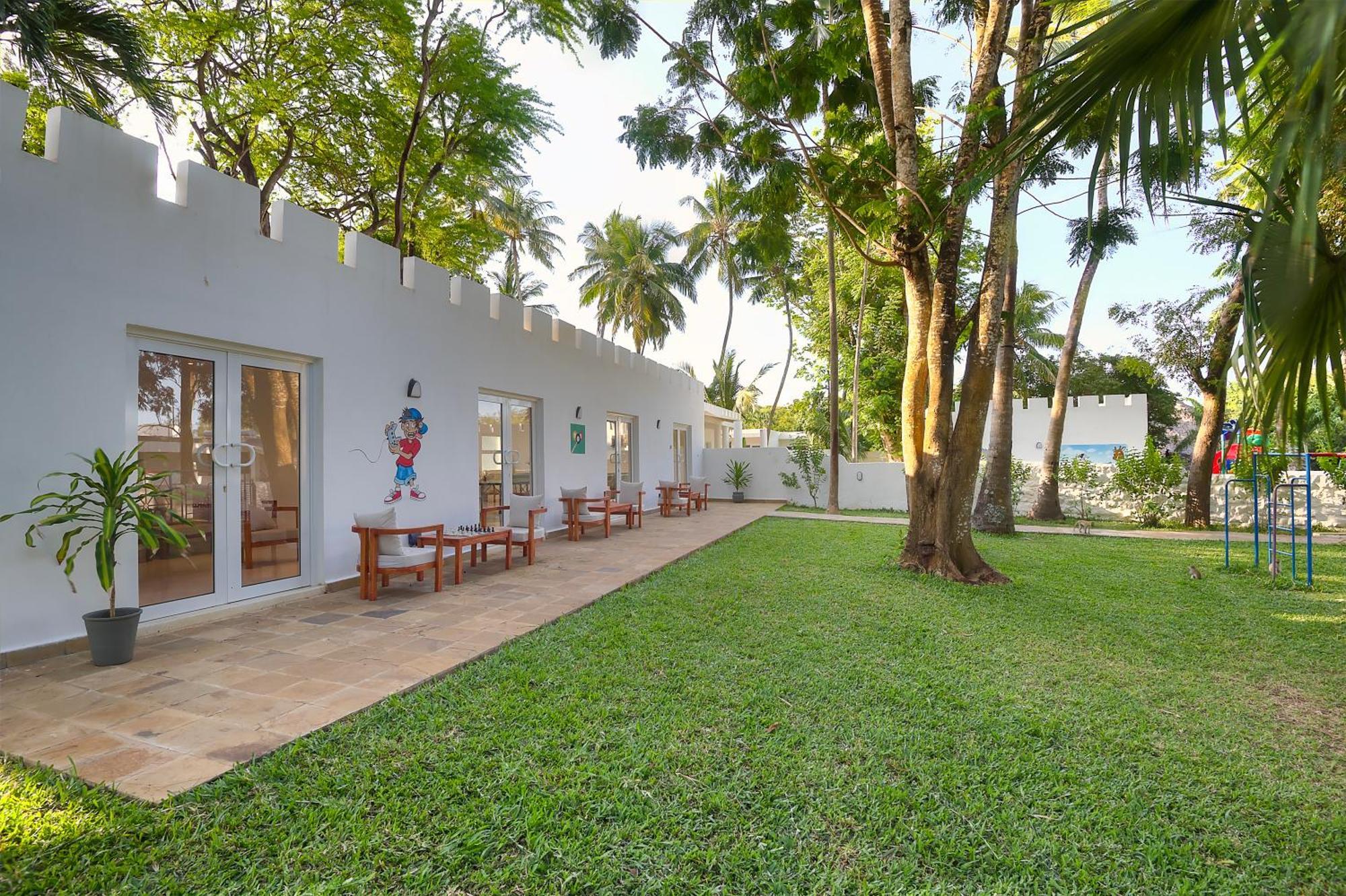 Diamonds Leisure Beach & Golf Resort Diani Beach Exterior photo The hotel's garden