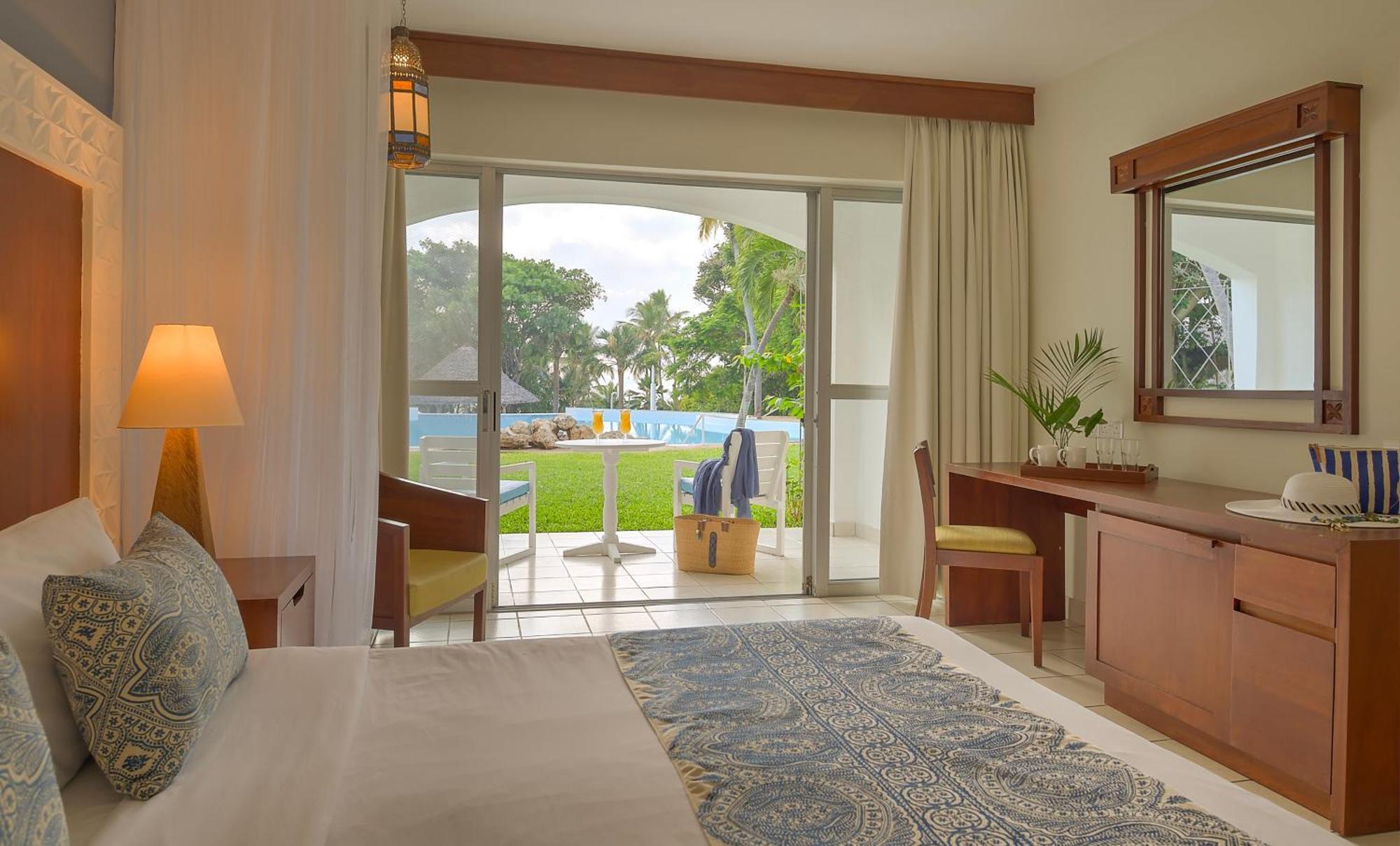 Diamonds Leisure Beach & Golf Resort Diani Beach Exterior photo A room at the resort